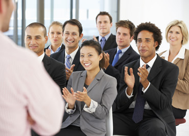 View of Language USA performing conference services to an audience.